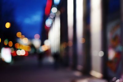 Defocused image of illuminated city at night