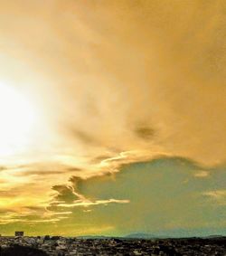 Scenic view of dramatic sky over land