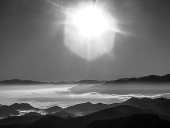 Scenic view of silhouette mountains against sky