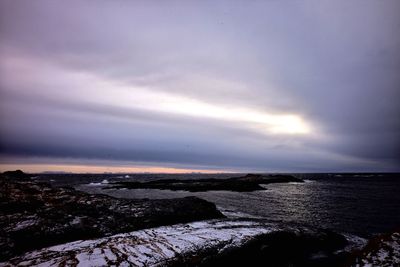 Scenic view of sea against sky at sunset