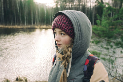 Portrait of young woman looking away