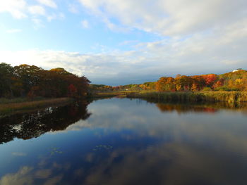 Scenic view of lake against sky during autumn