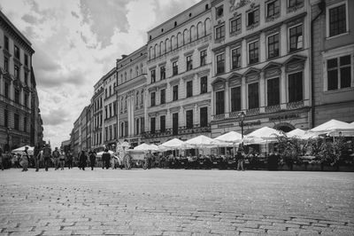 Street amidst buildings in city against sky