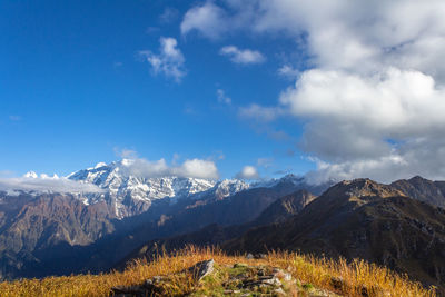 Scenic view of snowcapped mountains against sky