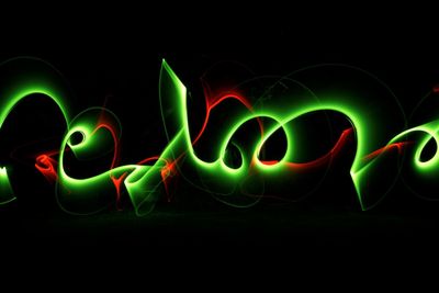 Close-up of light painting against black background