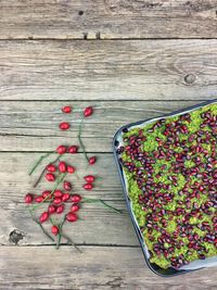 High angle view of spinach cake on wooden background