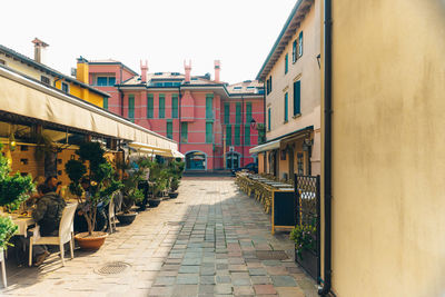 Street amidst buildings against sky