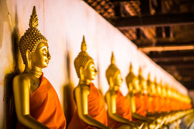 Statue of buddha against building