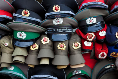 Full frame shot of military cap at market stall for sale