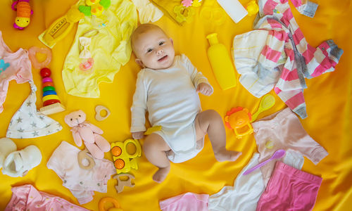 Portrait of cute girl playing with toys