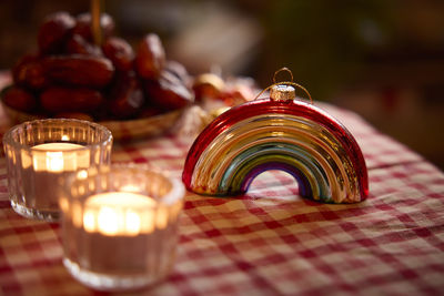 Rainbow christmas bauble and candles