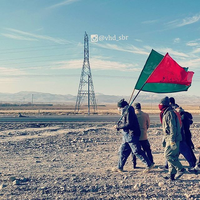 sky, landscape, leisure activity, men, lifestyles, sand, field, beach, full length, day, sunlight, outdoors, flag, communication, tranquility, nature, rear view, person