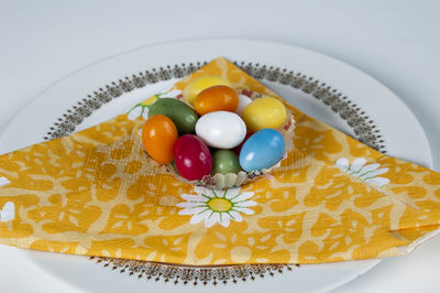 High angle view of multi colored candies on plate