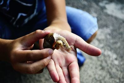 Midsection of person holding hands