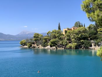 Scenic view of sea against clear blue sky