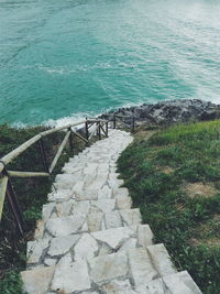 High angle view of steps leading towards sea