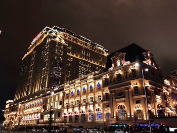 Low angle view of illuminated building at night