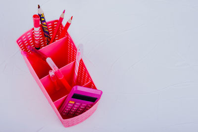 High angle view of chair on table against white background