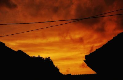 Low angle view of dramatic sky during sunset