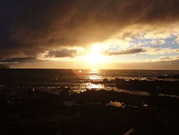 Scenic view of calm sea at sunset