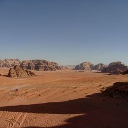 Scenic view of desert against clear sky