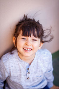 Portrait of smiling girl with tousled hair