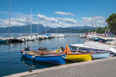 Boats moored at harbor