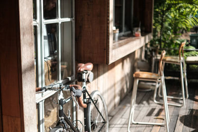 Bicycle on footpath by building in city