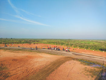 People on field against sky