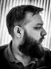 Close-up portrait of young man looking away