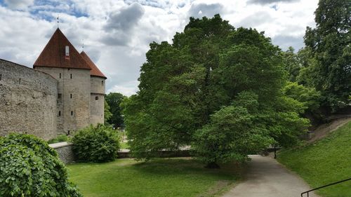 Fort against clouds with lawn in foreground