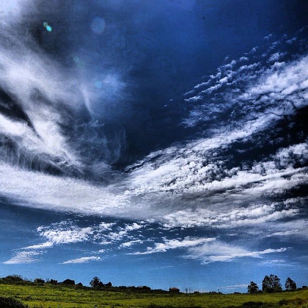 scenics, tranquil scene, beauty in nature, sky, tranquility, landscape, nature, cloud - sky, grass, idyllic, field, cloudy, weather, non-urban scene, mountain, tree, cloud, outdoors, no people, remote