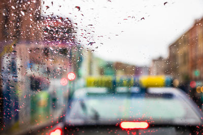City seen through wet glass window