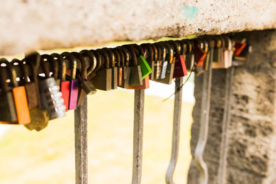 Close-up of padlocks hanging on metal