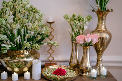 Close-up of roses in vase on table