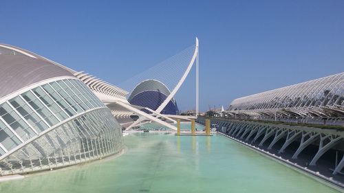 Bridge over swimming pool against sky