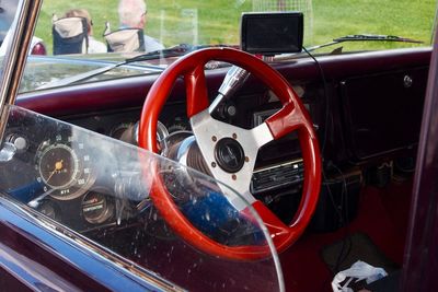 Close-up of red vintage car