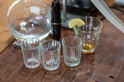 Close-up of wine glasses on table