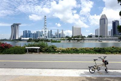 Modern cityscape against cloudy sky