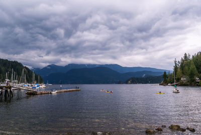 Boats moored at harbor