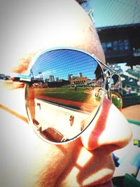 Close-up of hand holding sunglasses