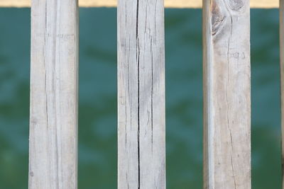 Close-up of wooden dock and water