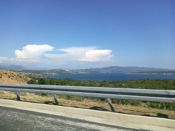 Scenic view of landscape against blue sky