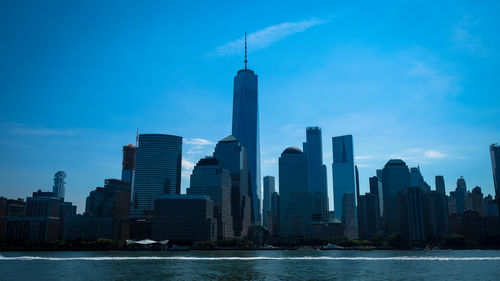 Modern buildings in city against sky