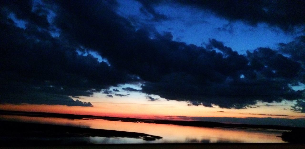 sky, scenics, tranquil scene, cloud - sky, tranquility, beauty in nature, water, sunset, cloudy, sea, nature, cloud, silhouette, idyllic, reflection, dusk, dramatic sky, horizon over water, weather, beach