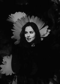 Young woman in costume in darkroom