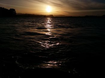 Scenic view of sea at sunset