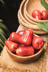 Close-up of tomatoes in basket on table