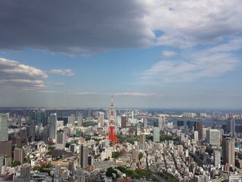 Aerial view of modern buildings in city against sky