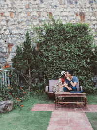 Couple sitting on a tree